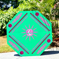 Hexagonal green and pink floating Mahjong Mat with floral designs and 'Mahjong Mermaid' logo for the pool.