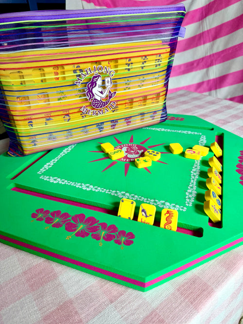 Green floating mahjong mat spa size with yellow floating tiles with colorful striped mesh tile bag