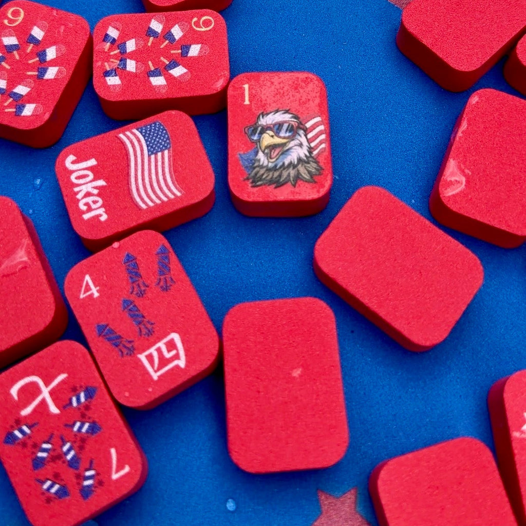Red game pieces with American flag design on a blue background