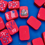 Red game pieces with American flag design on a blue background