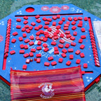 Blue patriotic floating mahjong mat with red patriotic mahjong tiles and a red tile bag floating in the pool