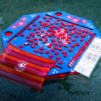 Blue patriotic floating mahjong mat with red patriotic mahjong tiles, a red tile bag, and waterproof card cover floating in the pool